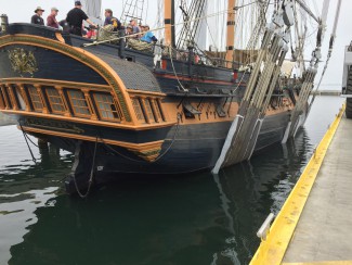 HMS Surprise being lowered into water at Marine Group