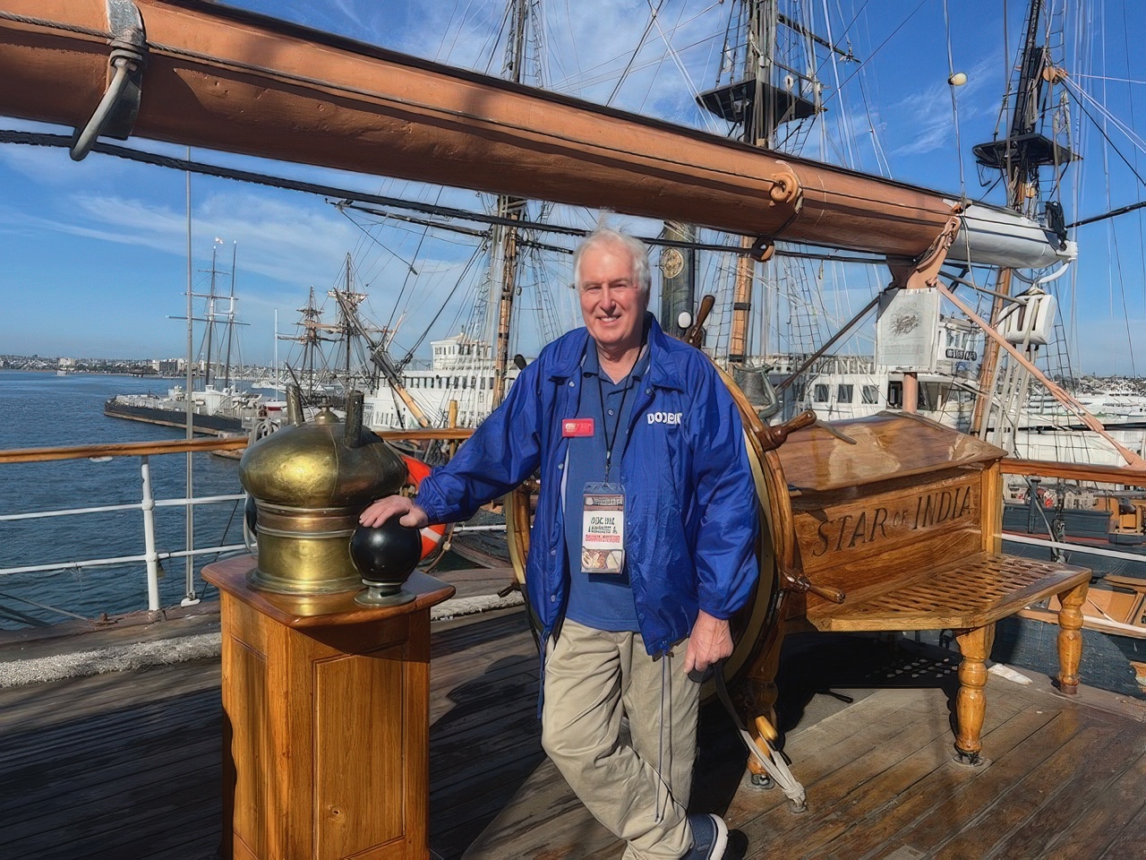 Docent standing at the helm compass of The Star of India